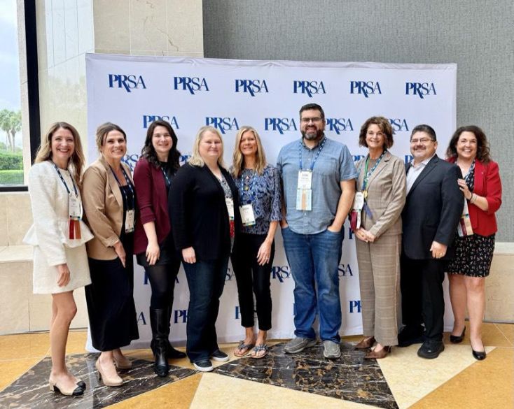 A group of PRSA Puget Sound members at ICON 2026 in front of a backdrop