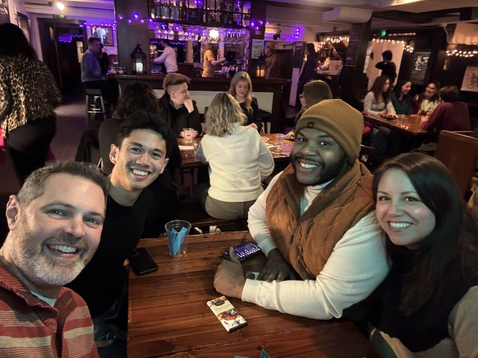 Members pose together during trivia